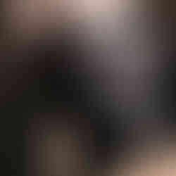 Black and white landscape art print of dramatic cliffs under heavy clouds.