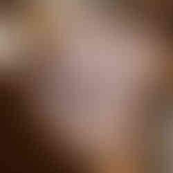 Illustration of a white cat sleeping on a stack of cushions with a pastel background.