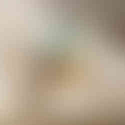 Minimalist illustration of a woman lying on a yellow couch in a pastel room.