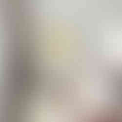 Illustration of a yellow lemon hanging from a branch with green leaves on a white background.