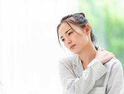 体調不良の女性