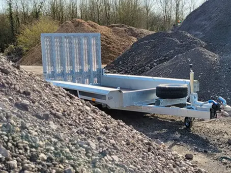 Trailer behind pile of rubble