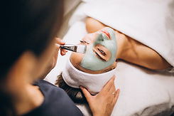 cosmetologist-applying-mask-face-client-beauty-salon.jpg