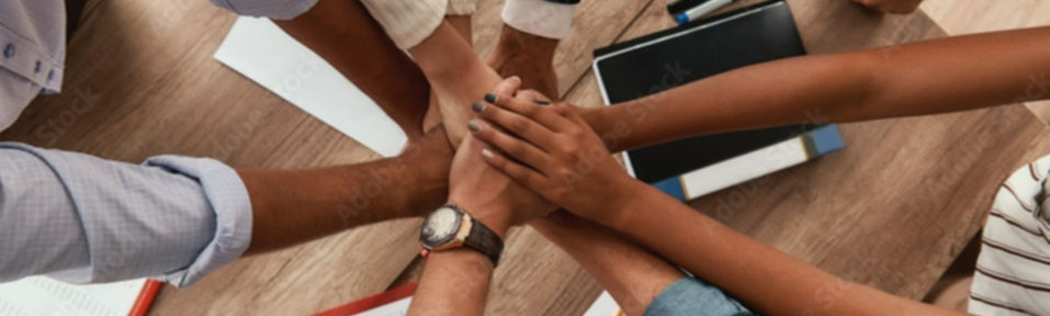 HR consultants join hands in unity, symbolising teamwork and collaboration in the field of human resources