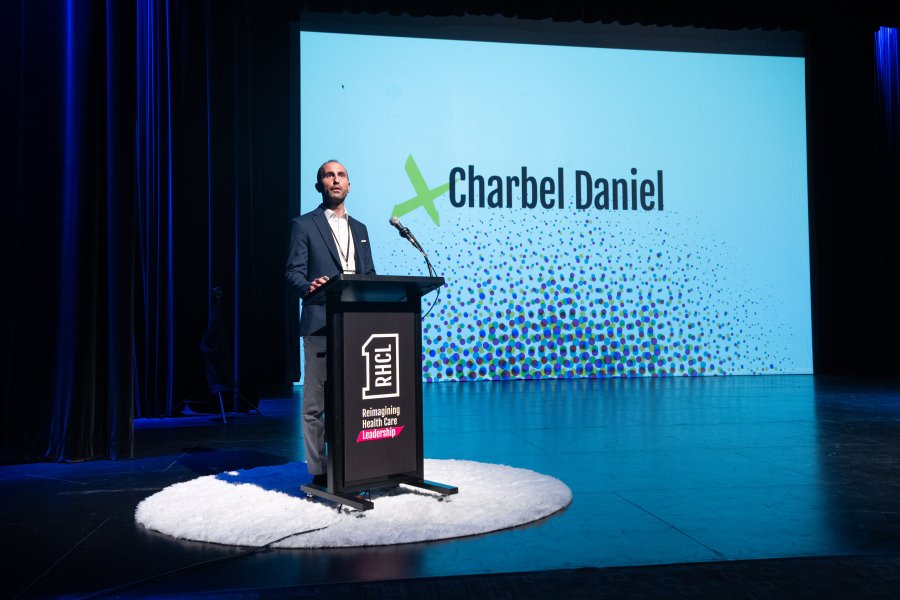 Charbel Daniel speaking at the Reimagining Healthcare Leadership Summit