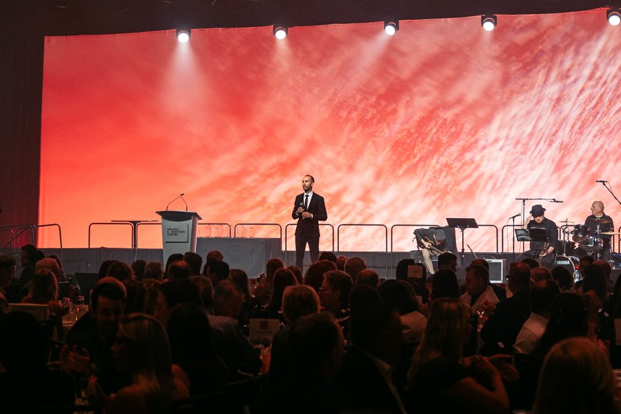 Charbel Daniel delivering a keynote at a gala dinner