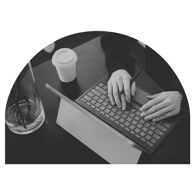 A person typing, working in their QMS