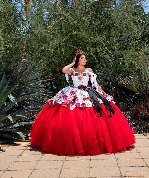 Quinceanera gown, a woman in a red and white dress posing for a picture