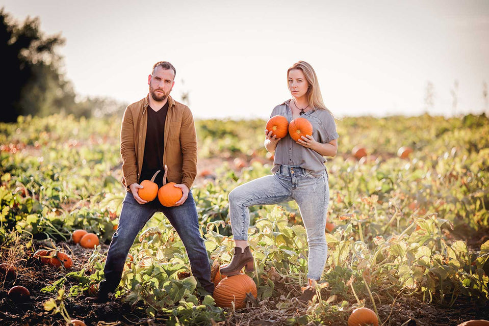 A couple being irreverent during their engagement session.