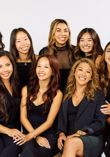 Team portrait of Love and Life Events wedding planners, all in black and smiling, providing expert wedding planning in Orange County and Los Angeles.