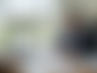 a female professional property manager reviewing rental property financial reports in a modern office.