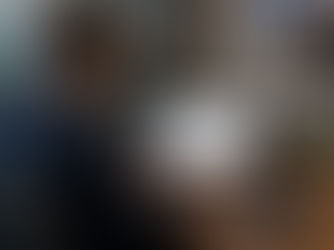 a property manager sitting in a clean, professional office working on a laptop that represents automated property management bookkeeping systems