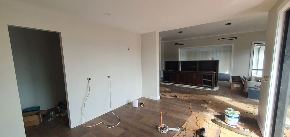 New Build home in Auckland with a Interior view of a house under construction with brown wooden floors.