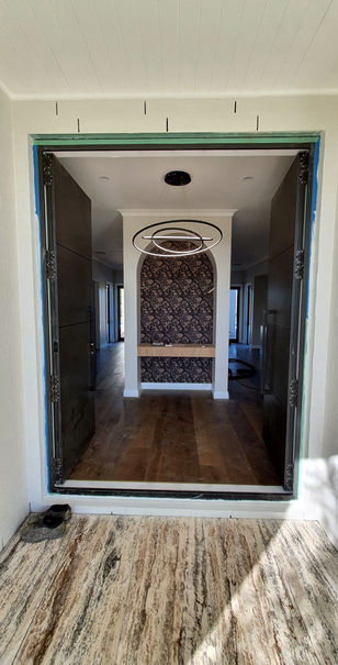 New Build home in Auckland with a Interior view of a new build home with an arched doorway, KARAKA NEW BUILD.