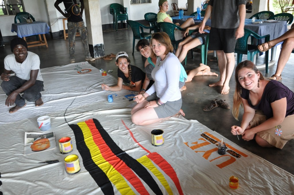 Members Andree, Cat, Sarah and Kyla work with UYE to design the backdrop for the night