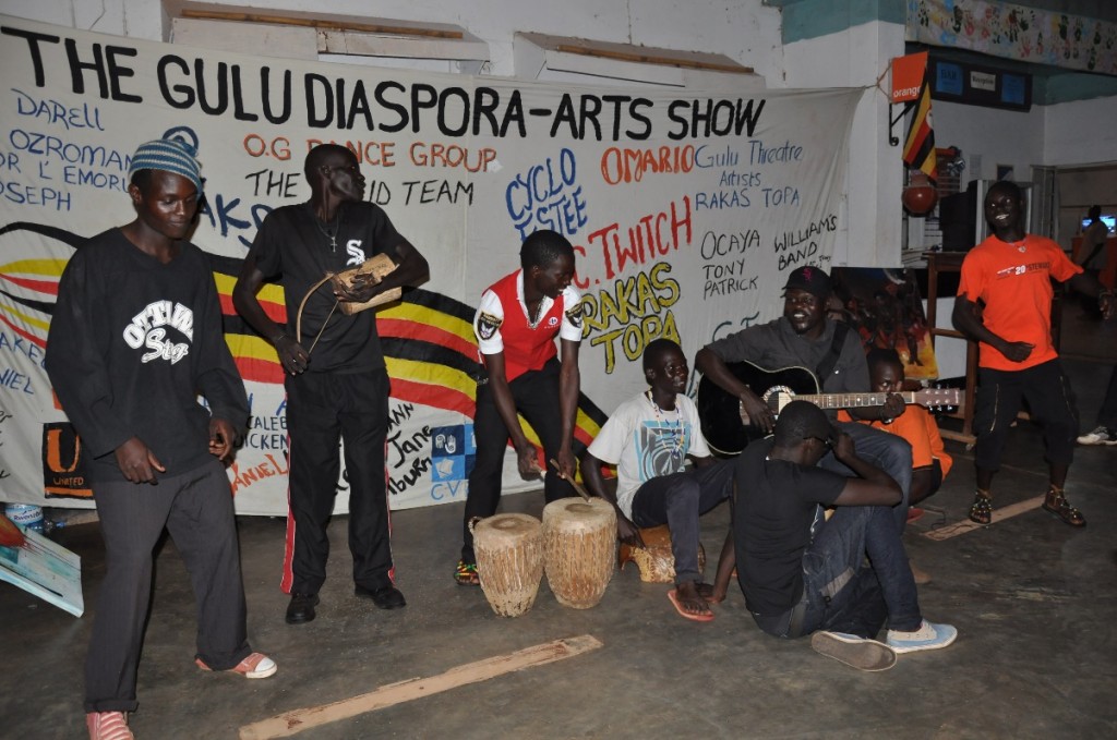 Local singer-songwriter Jeff Korondo with members of the Gulu Theatre Artists