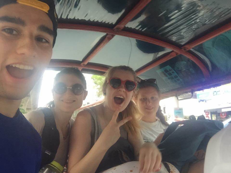 Hopping on one of our first tuk tuk rides cruising around the chaos and complexity of Bangkok! Photo by Chris Tuharsky.
