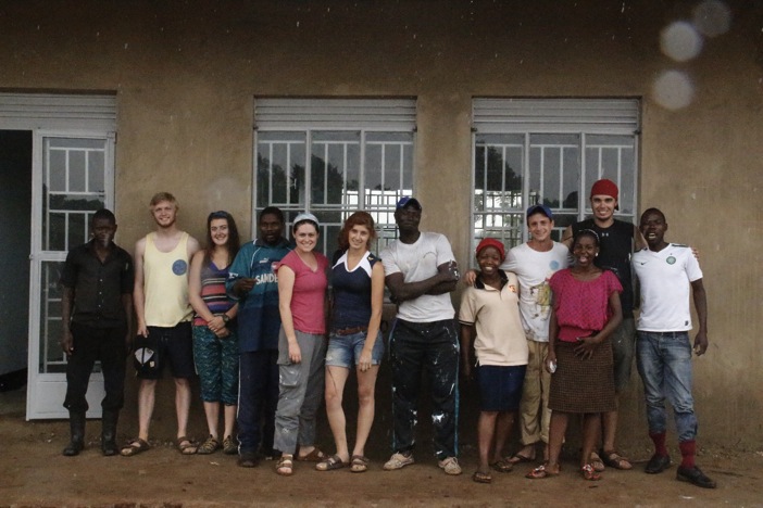 The team outside the newly-painted dormitories at the Ewafe Project.