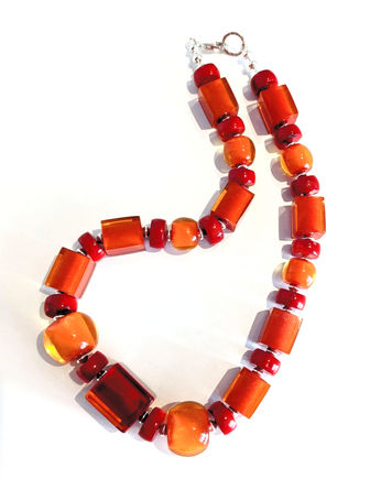 Acrylic orange beads with sea bamboo. Multi-shaped colourful acrylic beads. Sterling silver fittings and clasp.
Length: 20"     £65