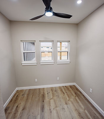Three strategically placed windows to allow for a desk under natural light in a small office study