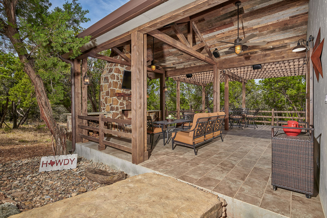 Entry with exposed truss and recycled barnwood ceiling.