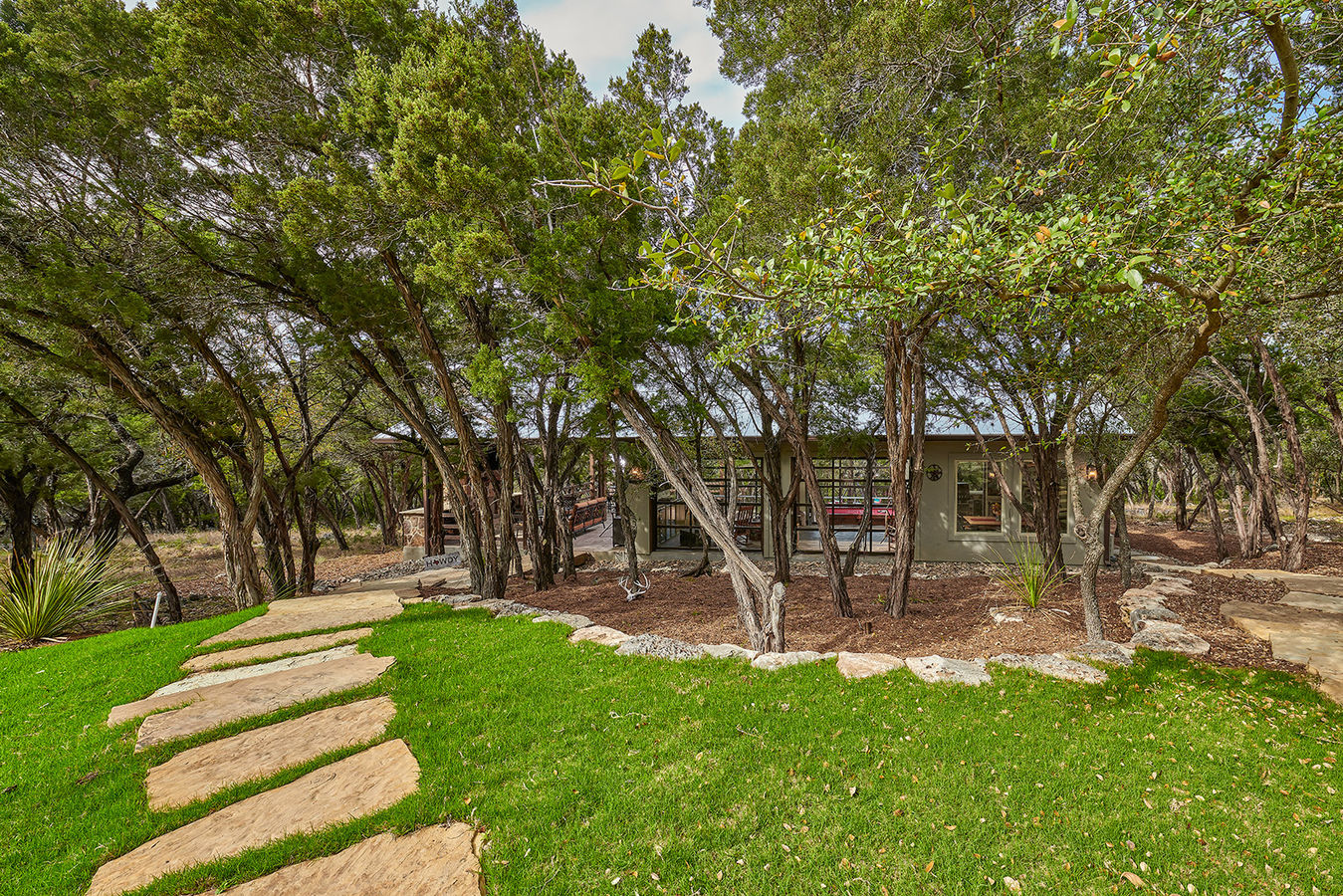 Nestled project protected by tree canopy to protect and shade the structure offering privacy and sense of place.
