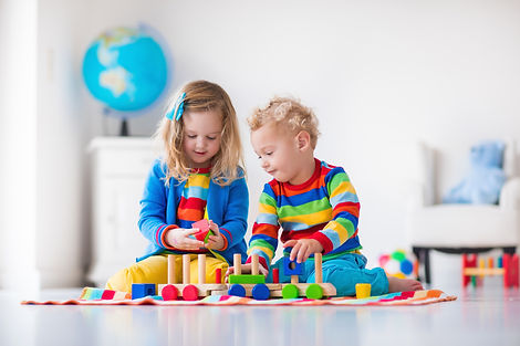Kids-playing-with-wooden-toy-train-50048