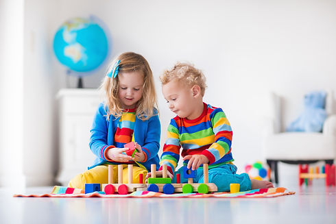 Kids-playing-with-wooden-toy-train-500480660_5000x3333.jpeg