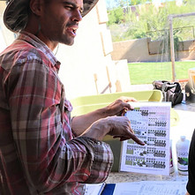 Thrive and Grow Garden Owner Michael Explaining Plant Calander
