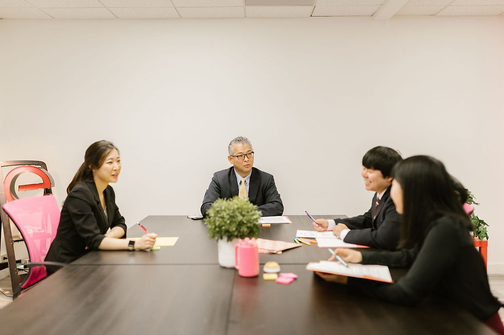 Community management team reviewing documents around a conference table