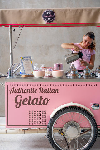 Woman serving at an authentic Italian gelato cart