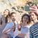Friends relaxing together on a beach during a group trip