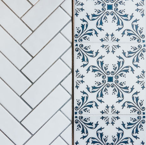 herringbone pattern tile and marble backsplash