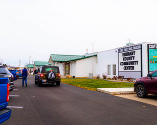 Exterior view of the Elkhart County Community Center in Goshen Indiana, showing the newly renovated building and roadside signage at the Elkhart County 4-H Fairgrounds.