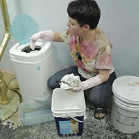 Corky is soaking a shirt in soda ash water, before tie dyeing