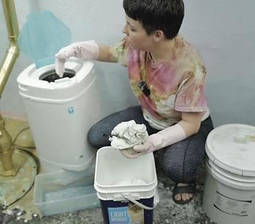 Corky is soaking a shirt in soda ash water, before tie dyeing