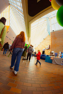 Wide view of the interior hallways of the Century Center venue in South Bend with large window ceilings