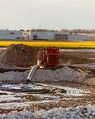 A large capacity pump on freshly broken ground in front of MORyde on CR19, in Elkhart.