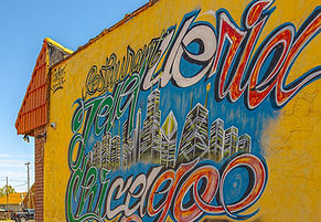 Mural of the the side of the yellow Taqueria Chicago building in South Bend, Indiana.