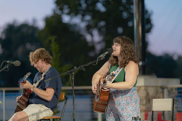 Live musicians performing at the Mishawaka Farmers Market Under the Lights at Ironworks Plaza.