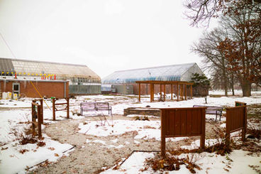 Exterior view of the buildings for Potawatomi Conservatories, with snow on the ground.
