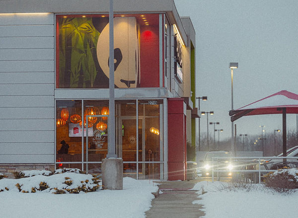 Dusk outside view of the Panda Express front entrance.