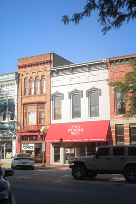 Historic brick storefronts and The Floor Store in downtown Plymouth, Indiana.
