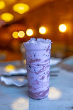 Taro milk tea in a clear plastic cup inside Afuri Ramen, in Elkhart.