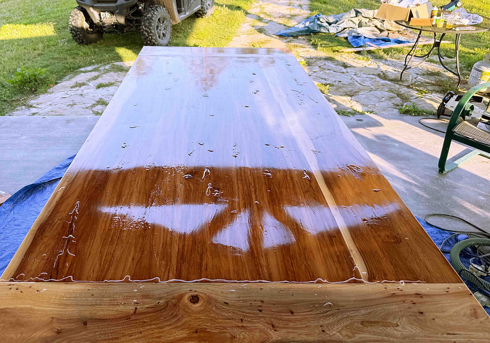 Once that cured, I went over the table one final time looking for any imperfection, crack or pit and applied epoxy so we can ensure a perfectly flat level table. I performed this after the previous coats because in doing it first, it eliminate any shadowing that the epoxy may create on bare wood.