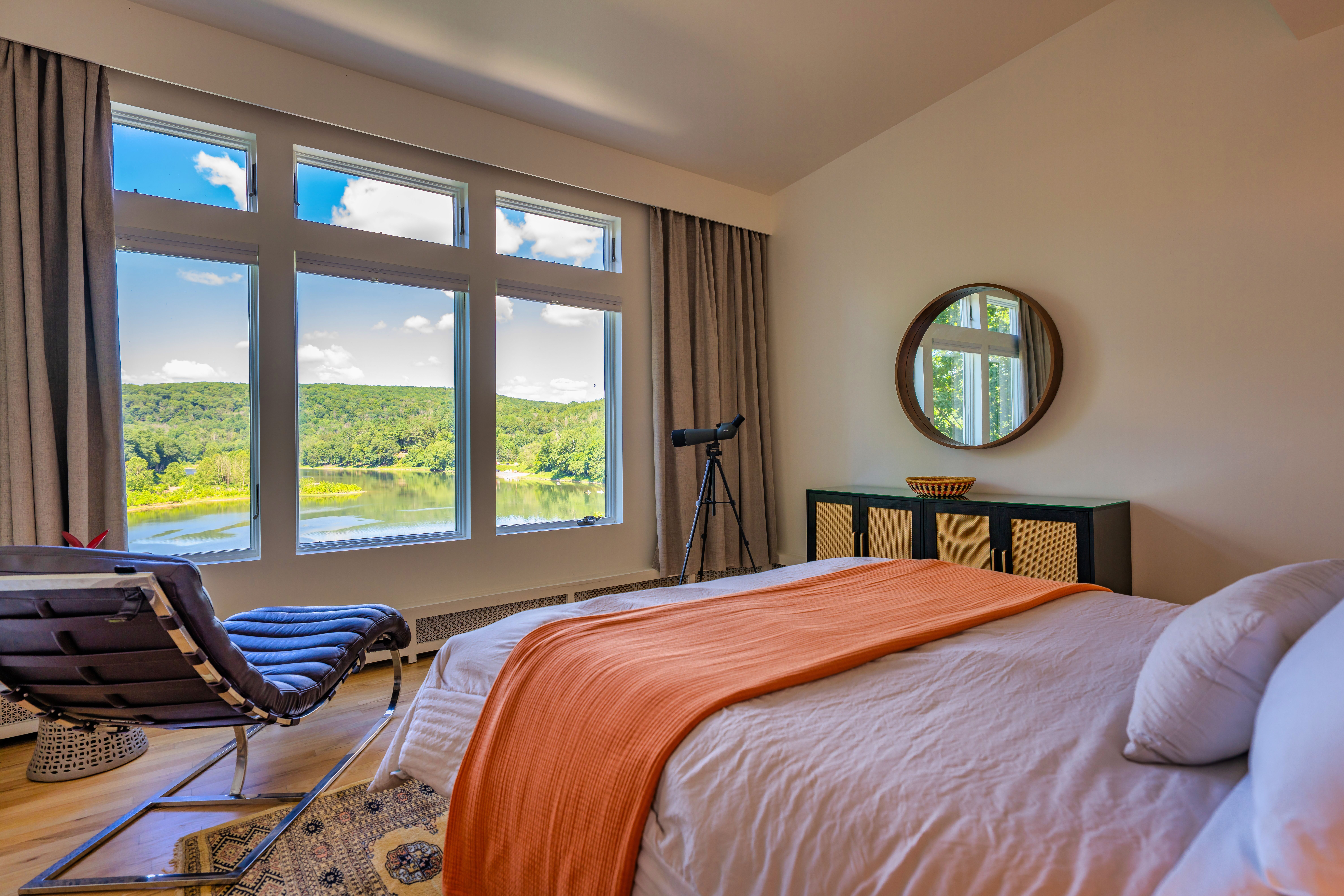 Queen bedroom with Delaware River view at River Penthouse Narrowsburg NY