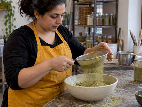 Henna powder being sifted into a bowl