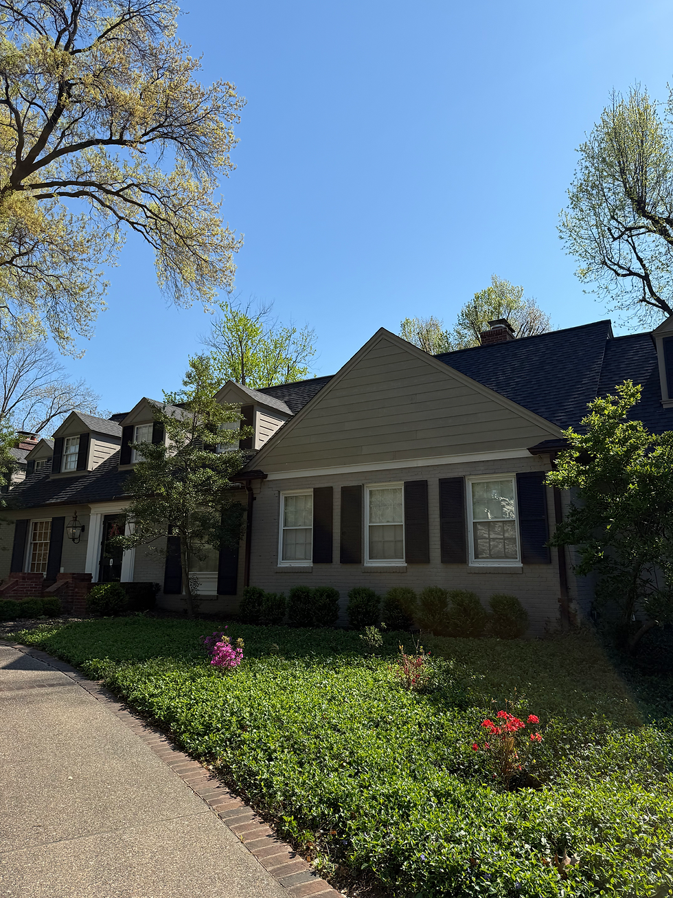 Eye-level view of a newly installed asphalt shingle roof on a residential home