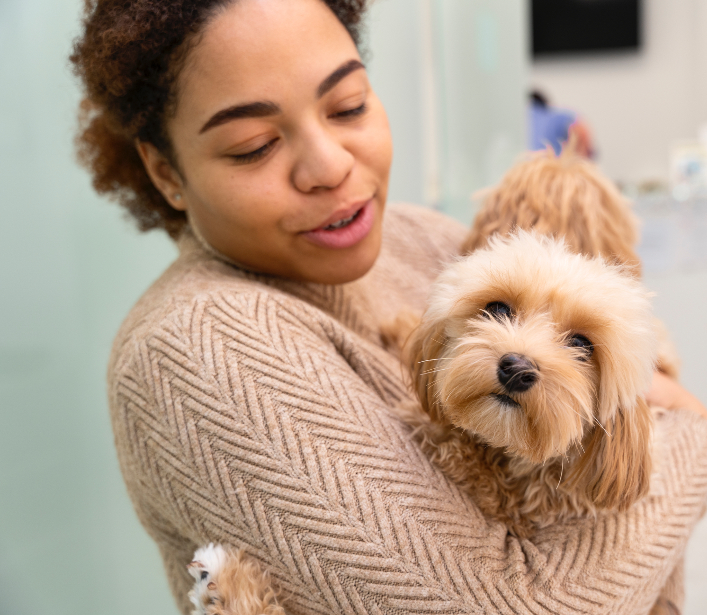 Pet parent with groomed dog at Kokoni
