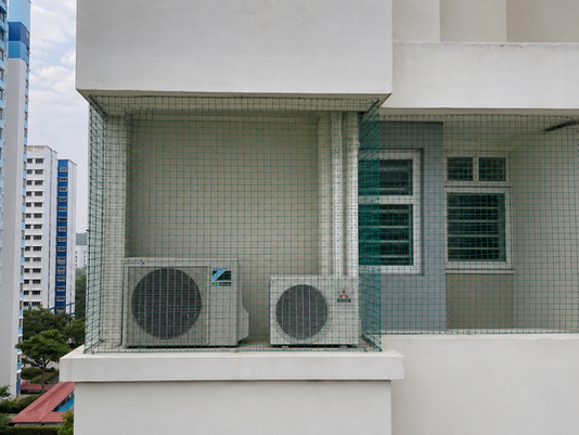 Bird netting installed on HDB aircon ledge in Singapore